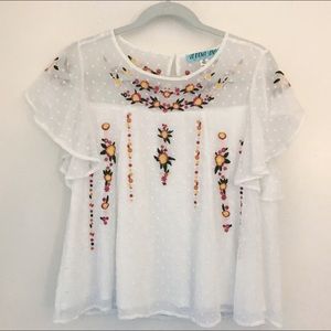 Francesca’s white embroidered swing blouse